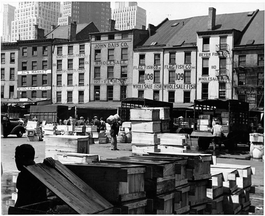 #71 Workers at dock of Fulton Fish Market in New York City, 1955.