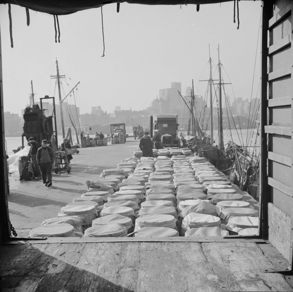 #12 Barrels of fish on the docks at Fulton fish market ready to be shipped to retailers and wholesalers, 1920s
