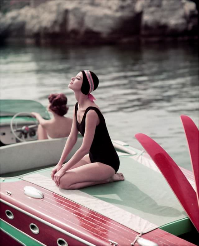 #13 Barbara Mullen and Marie-Helene (at the helm), Cap D’Antibes, Eden Roc, 1957