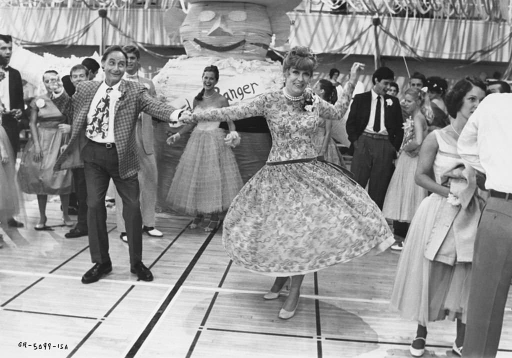 Eve Arden as Principal McGee and Sid Caesar as Coach Calhoun in a scene from the Paramount musical ‘Grease’, 1978.