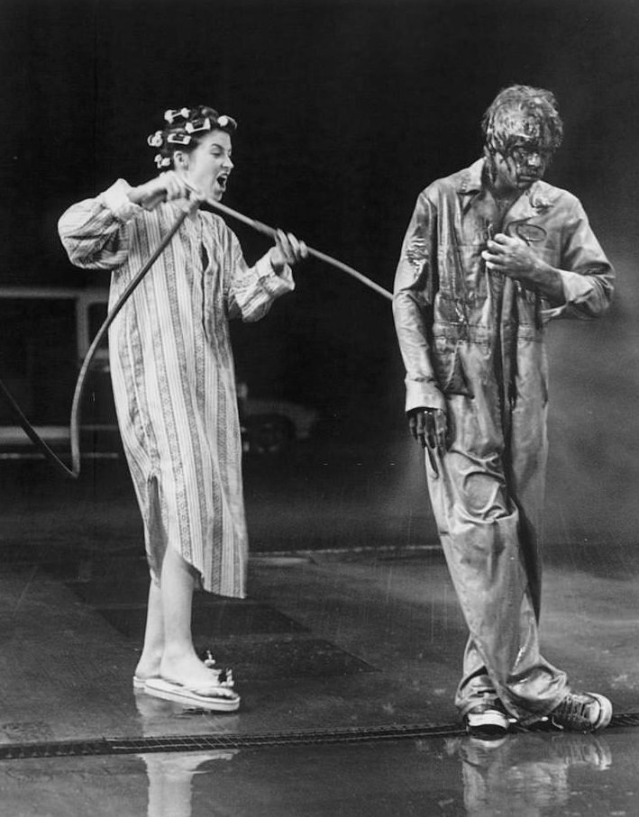 Annie Potts uses a do-it-yourself car wash to clean up her motor oil-soaked boy friend Mark Hamill’, 1978.
