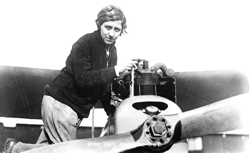 #20 Amy Johnson CBE, (1903-1941), a pioneering English aviatrix, seen here adjusting the engine of a de Havilland DH60 Moth.