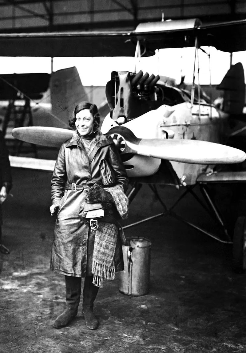 #23 English aviatrix Amy Johnson (1903-1941) shown at a landing in Berlin. She was the first woman to make a solo flight from London to Australia in 1930.