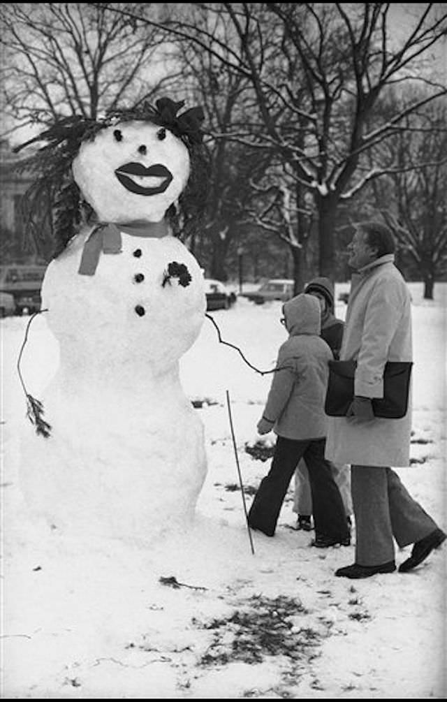 #27 President Jimmy Carter admires a snowman on the lawn of the White House in Washington, January 1978.