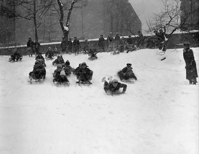 #38 Children sledding, 1935.
