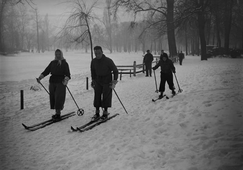 #8 A family goes skiing in the Bois de Vincennes near Paris, France, January 1945.
