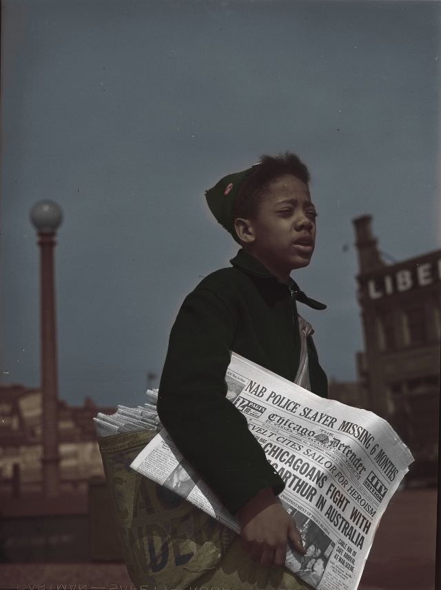 #23 Newsboy selling the Chicago Defender, a leading Negro newspaper, Chicago, Illinois, April 1942