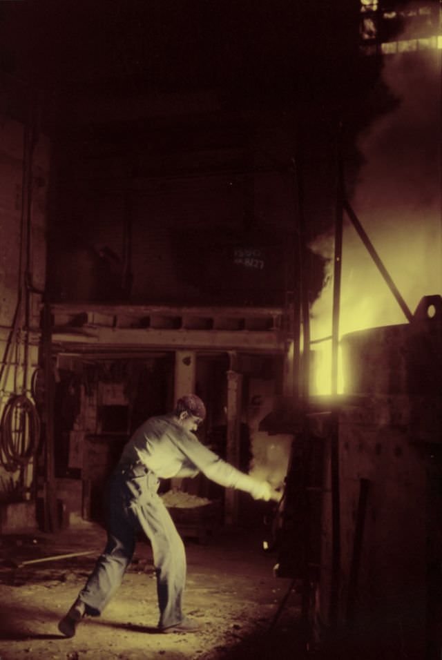 #6 At the electric furnace in the foundry at the Farrell-Birmingham Company, Ansonia, Connecticut, November 1940