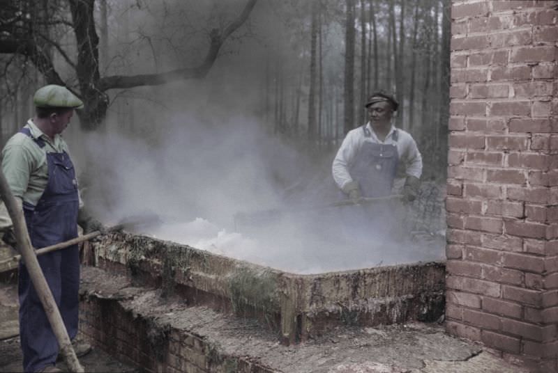 #8 Cleaning turpentine cups in boiling water at a still near Pembroke, Georgia, 1941