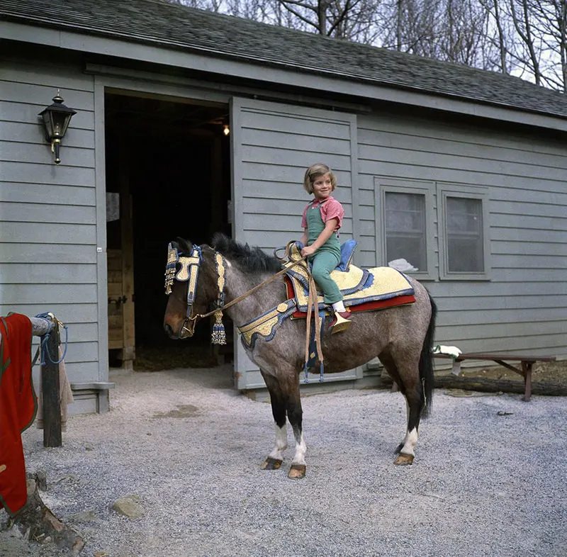 #15 During a weekend at Camp David, Caroline and Macaroni test out a new saddle given to the family by King Hassan II of Morocco.