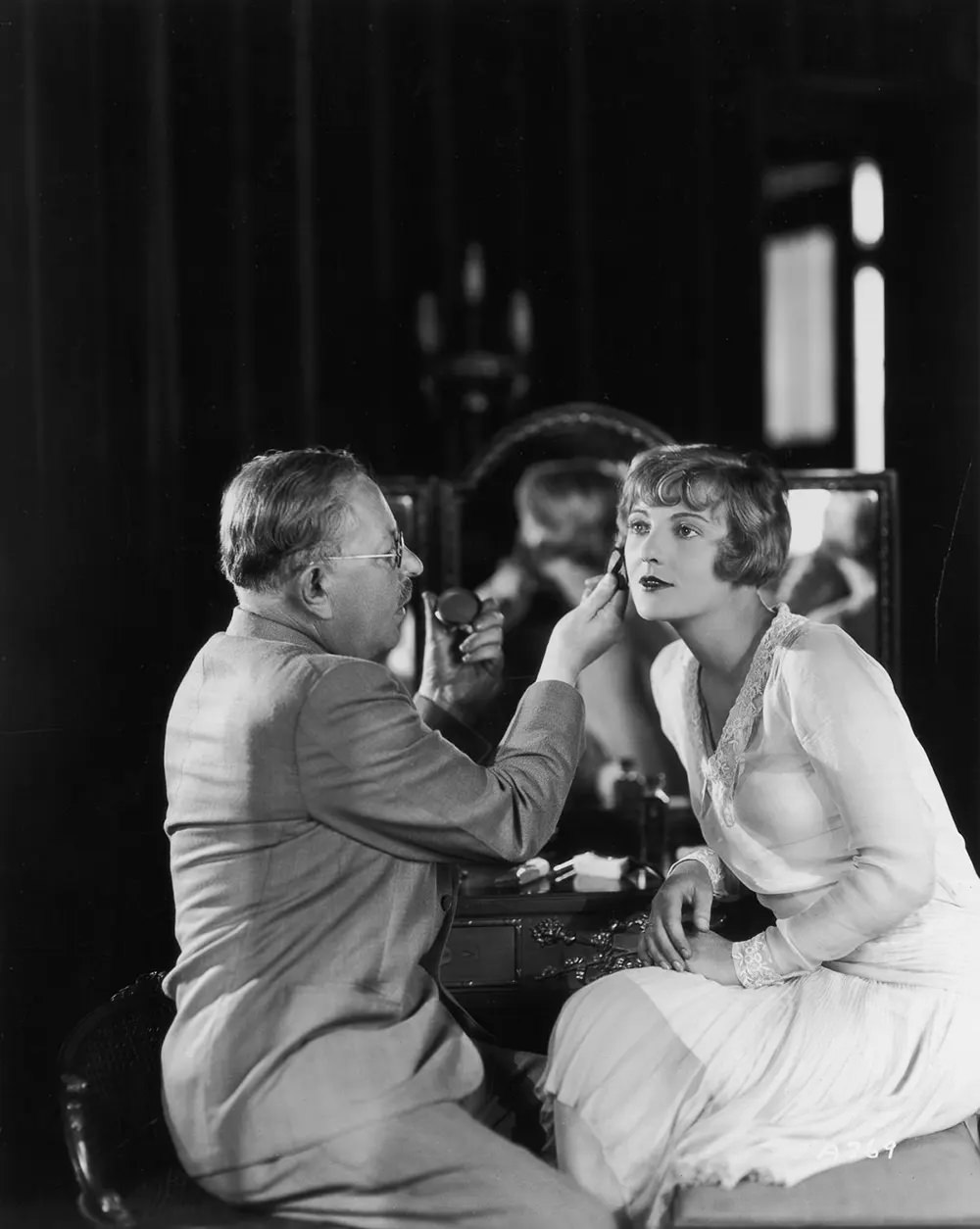 #14 Factor applies makeup to actress Dorothy Mackail. 1930.