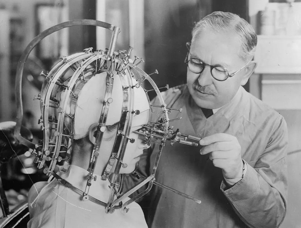 #2 Factor takes measurements of a woman’s features with a beauty micrometer.