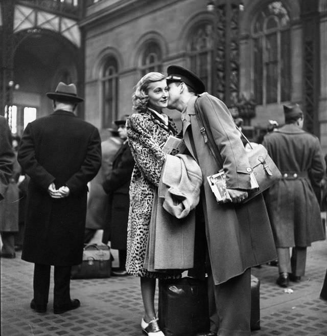 #14 Couple in Penn Station saying goodbye before he ships off to war during WWII, New York, 1943.