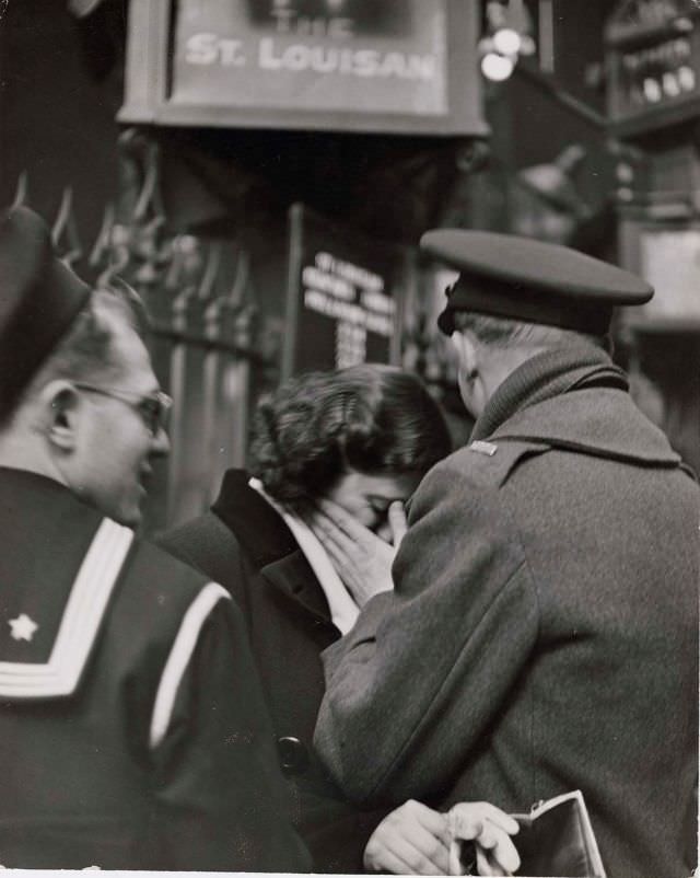 #15 Soldier consoling his weeping girlfriend while saying goodbye in Pennsylvania Station before returning to duty after a brief furlough, New York, 1943.