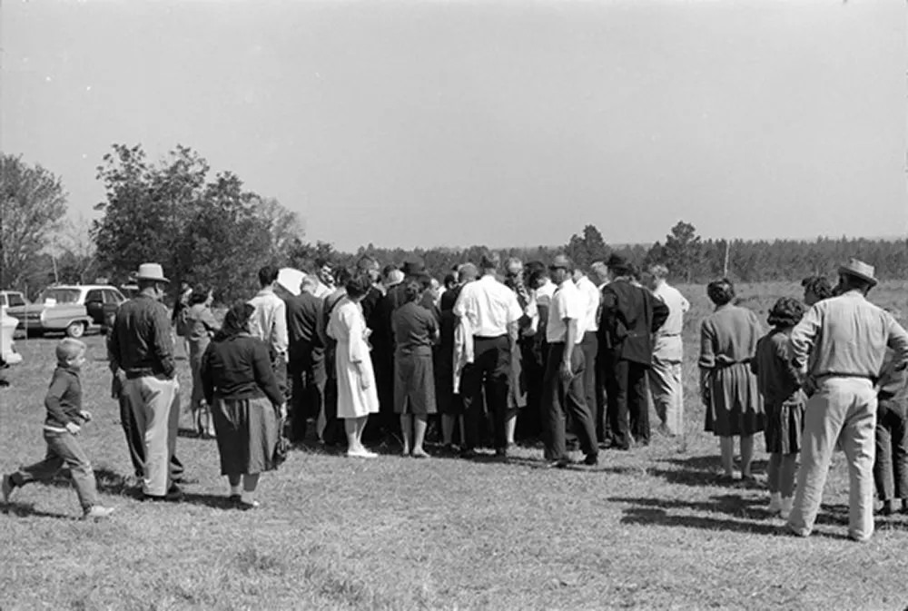 #16 Crowds gather a distance from the Tatum Salt Dome nuclear test site on October 22, 1964.