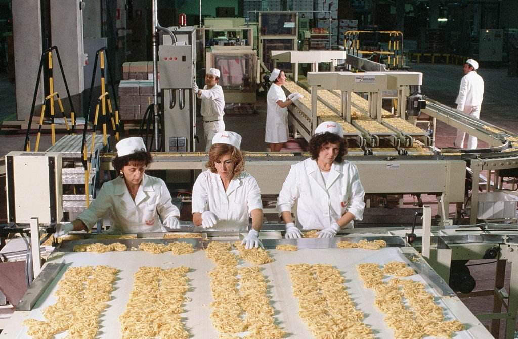 #30 Women sort pasta in the Buitoni pasta factory in Sansepolchro, Italy.