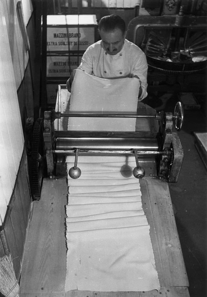 #47 A chef making tagliatelle at King Bomba’s, one of the largest Italian shops in Soho, London, 1939