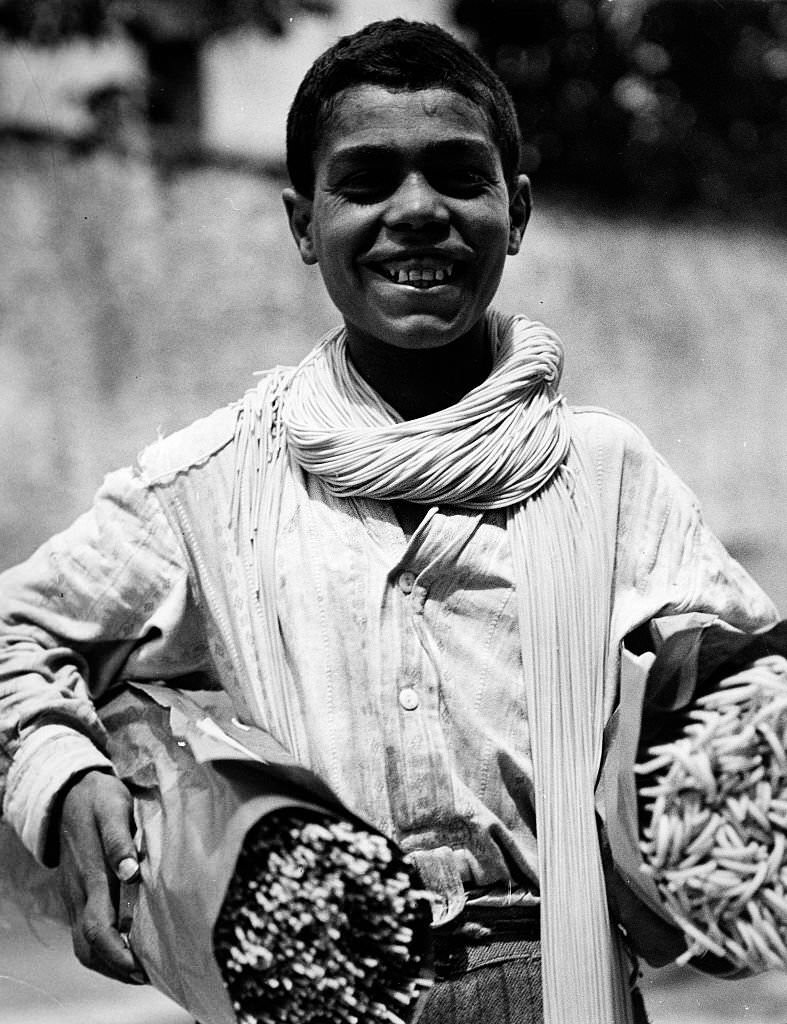 #60 Neapolitan boy carrying two bundles of spaghetti in Italy, 1932
