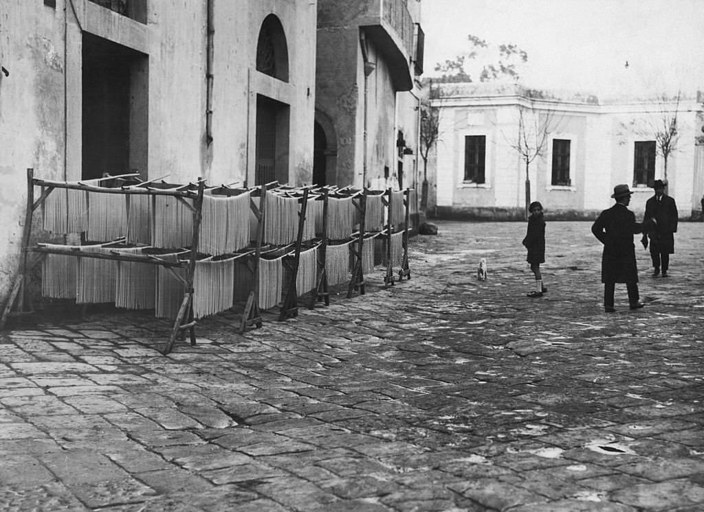 #73 Strands of macaroni being hung out to dry, Italy, 1925.