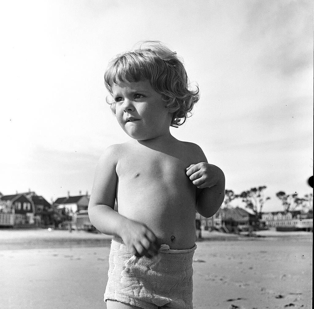 #121 A young child standing on a beach, Provincetown, Massachusetts, 1948.
