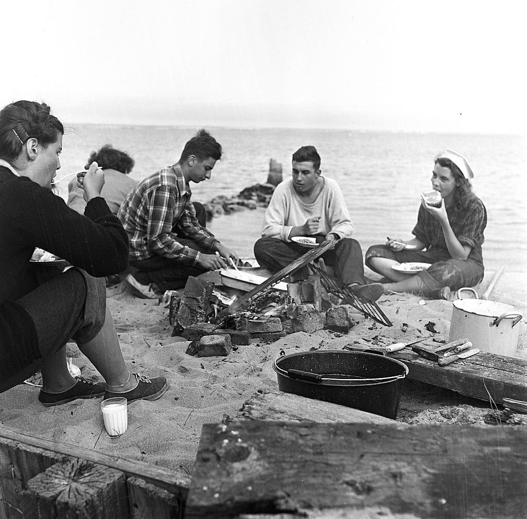 #123 Five friends gather around for a beachside cookout, Provincetown, Massachusetts, 1948.