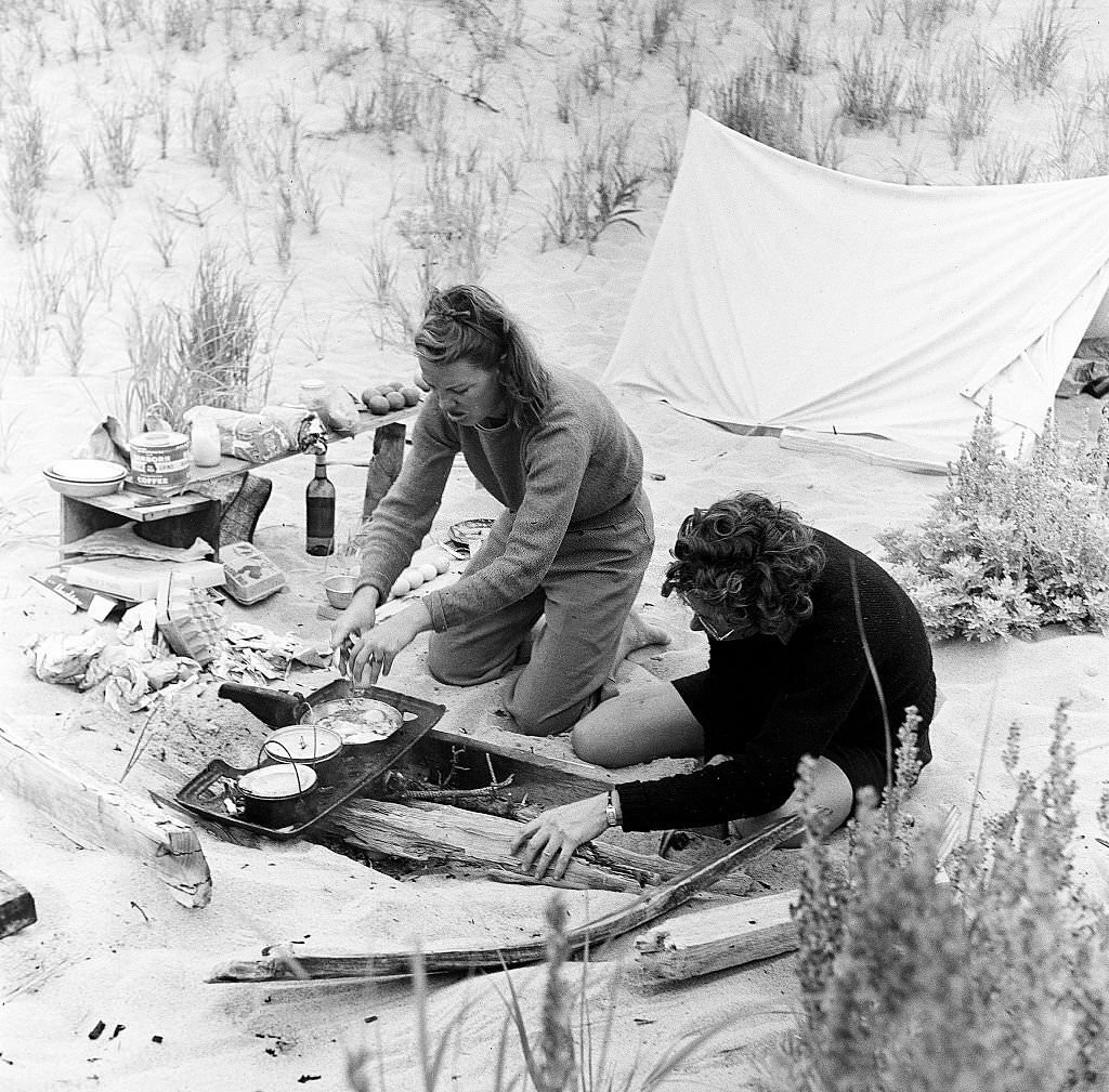 #20 A couple prepares food while camping on the beach on Cape Cod, Provincetown, Massachussetts, 1947.