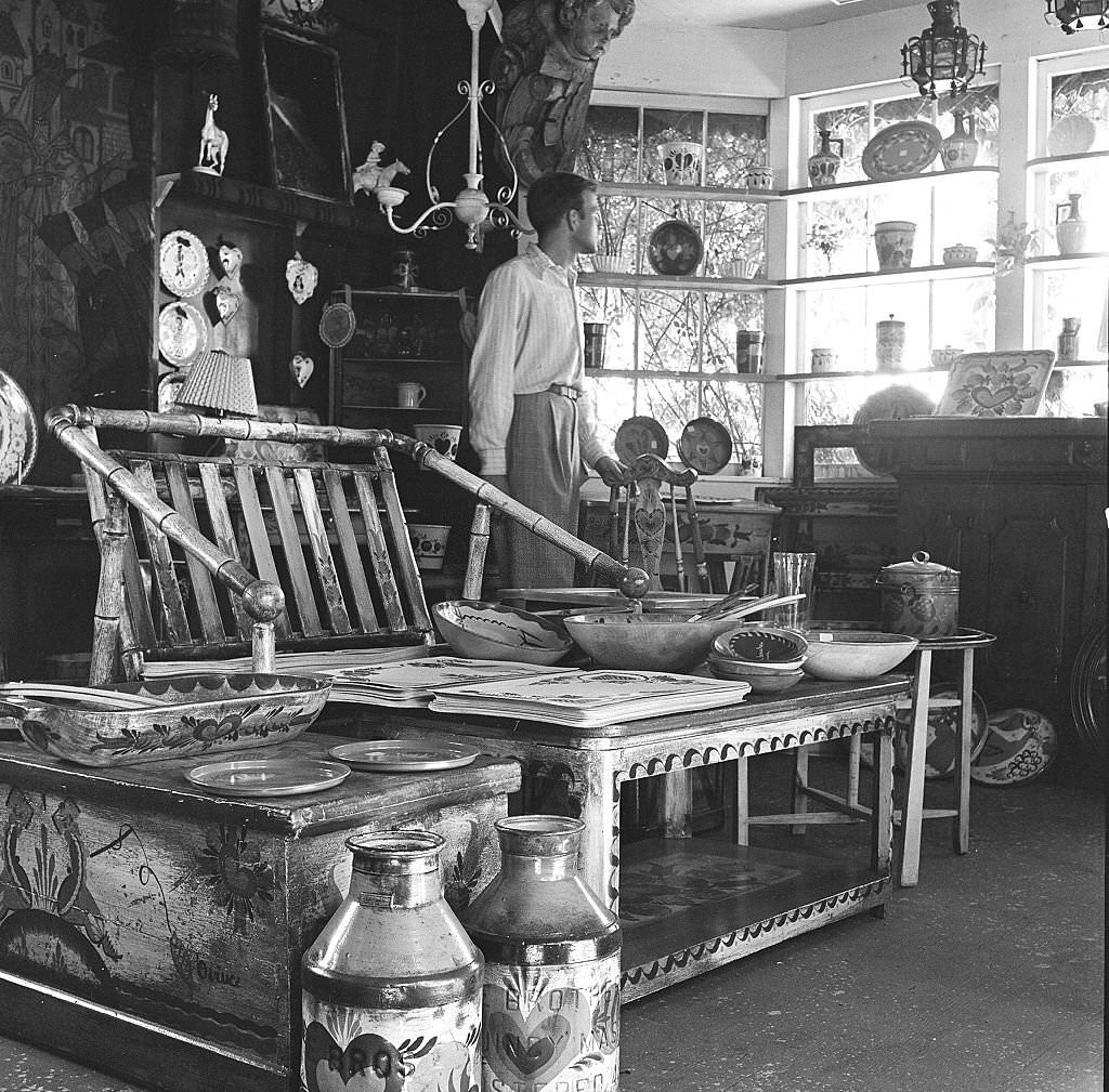 #54 Visitors look at various items at an antique shop, Provincetown, Massachusetts, 1948.