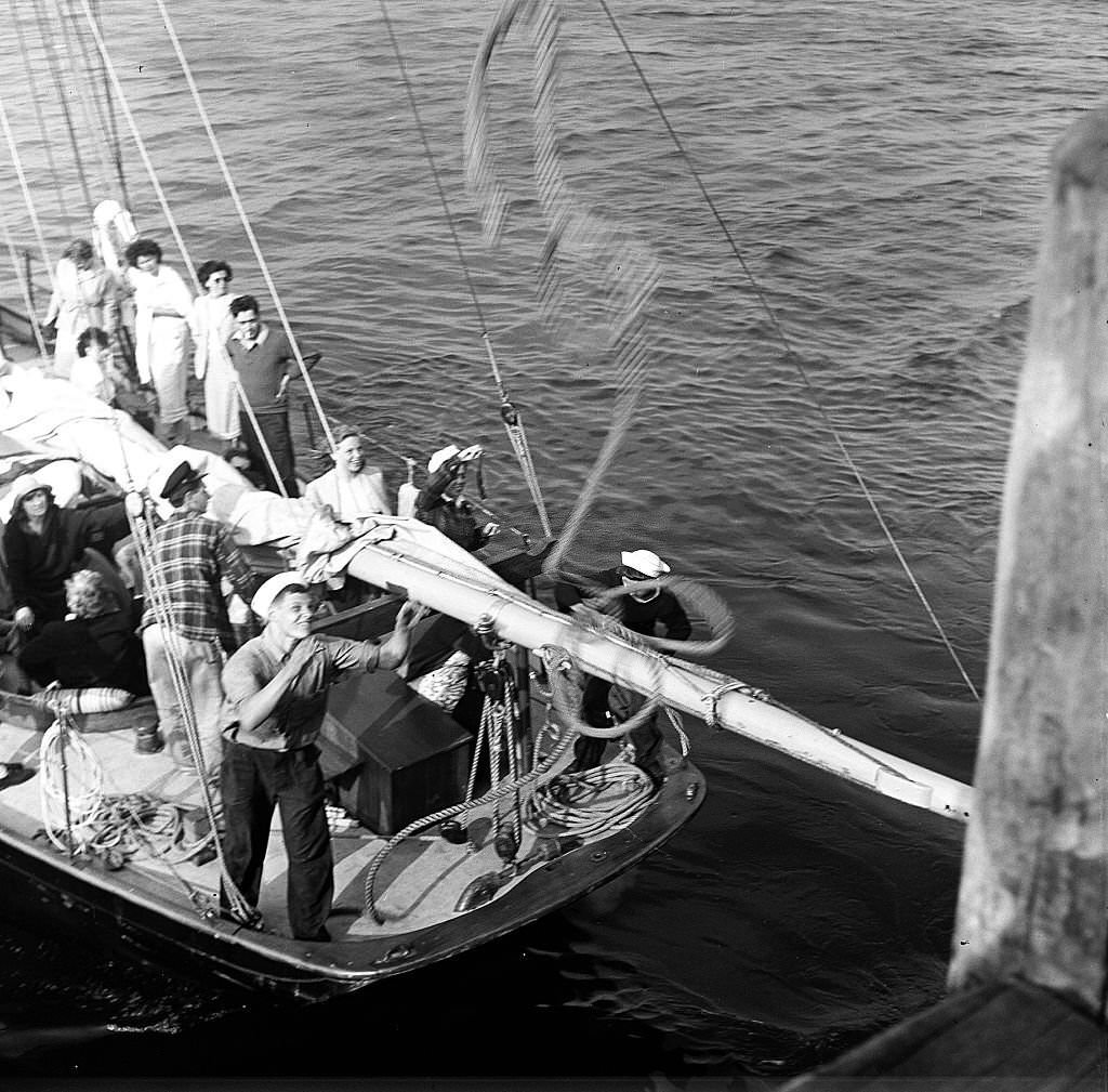 #66 Visitors disembark from a boat at the pier, Provincetown, Massachusetts, 1948.