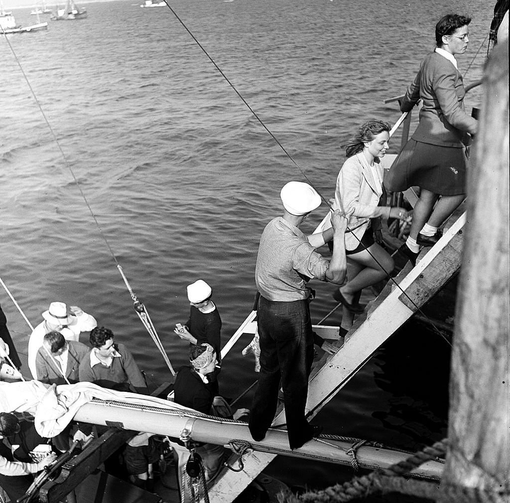 #68 Visitors disembark from a boat at the pier, Provincetown, Massachusetts, 1948.