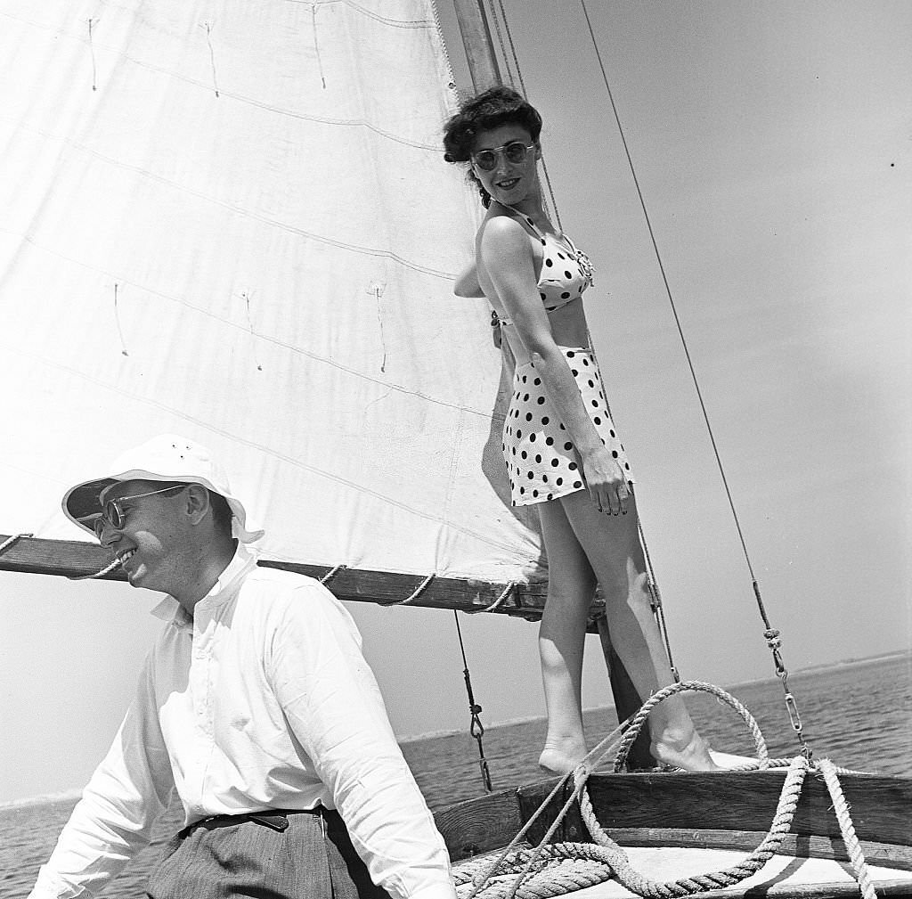 #11 A man and a woman enjoy sailing on the waters off Provincetown on Cape Cod, near Provincetown, Massachussetts, 1947.