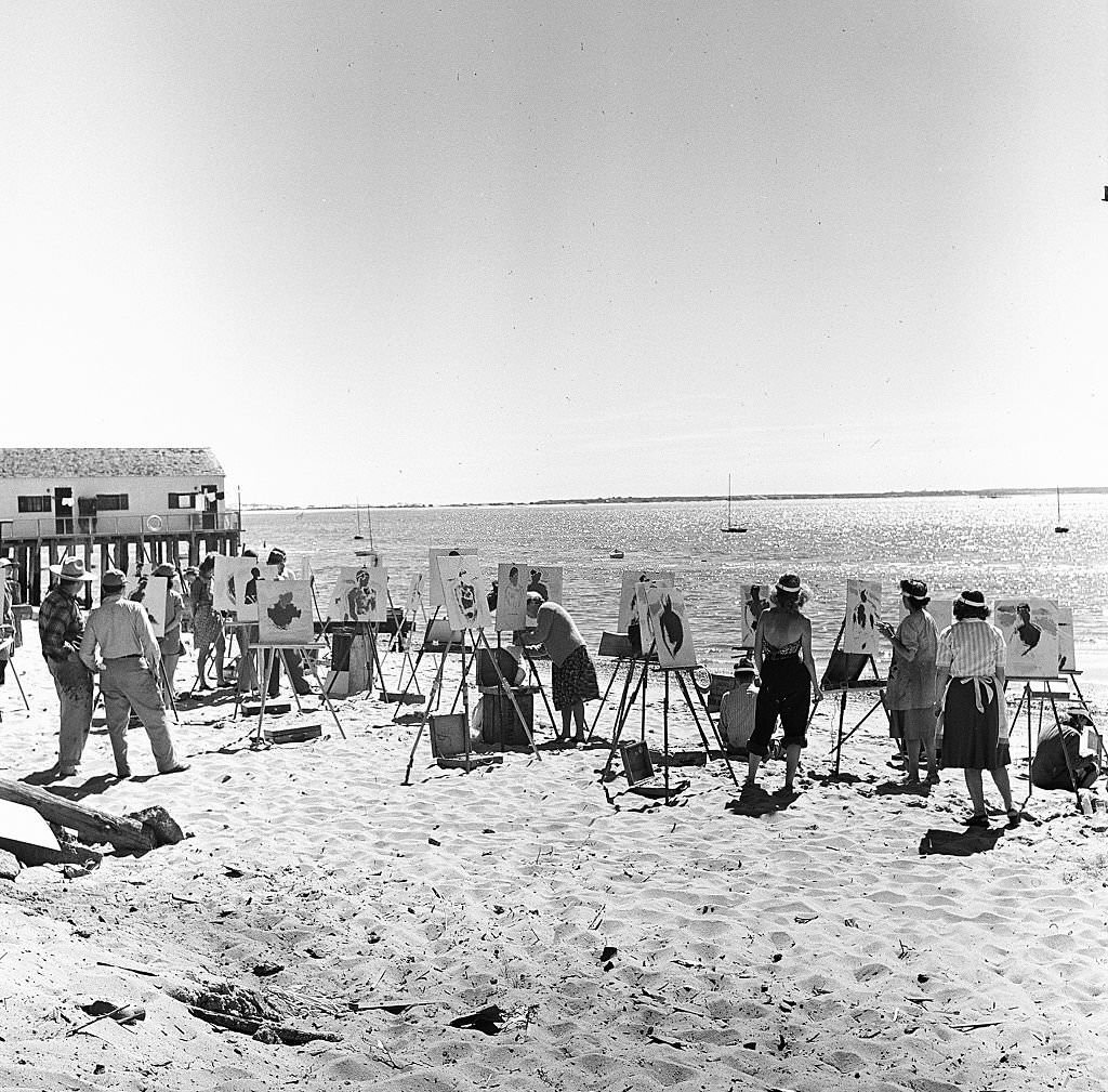 #72 A group of painters set up their easels and paint while on the beach on Cape Cod, Provincetown, Massachussetts, 1947.