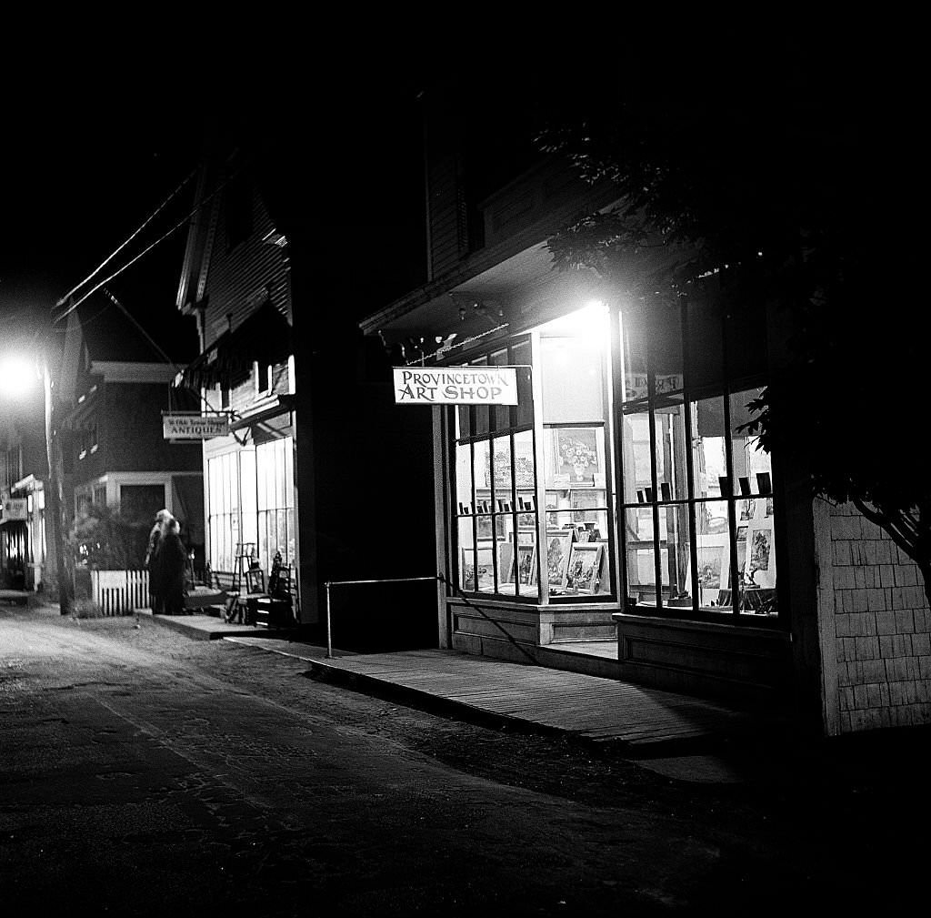 #95 Night time view showing the window of the Provincetown Art Shop, Provincetown, Massachusetts, 1948.