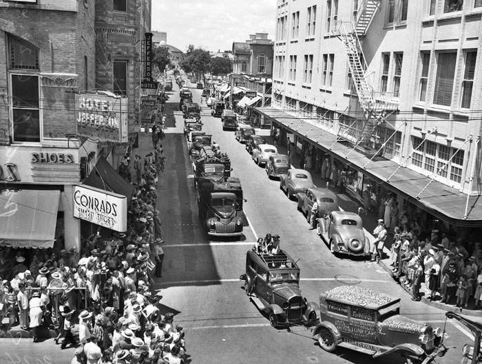 #62 Parade of junk cars on Jefferson Street, 1943. Looking north on Jefferson Street, from Broadway, toward jalopy parade.