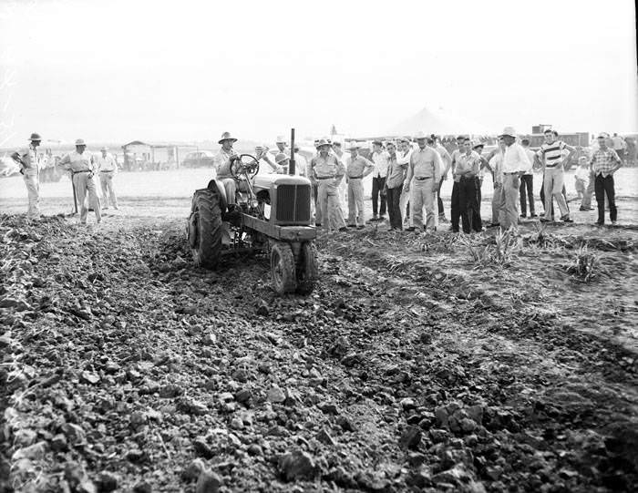 #79 Spectators watch tractor demonstration on Eisenhauer farm near San Antonio, 1949