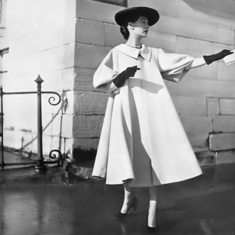 #6 Sophie Malgat in swingy pink wool coat, cut on the bias with collar placed well away from the neck and short sleeves by Mad Carpentier, Harper’s Bazaar, April 1951