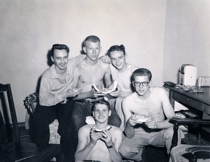 #46 Just a bunch of guys hanging out, eating melon, 1950s.