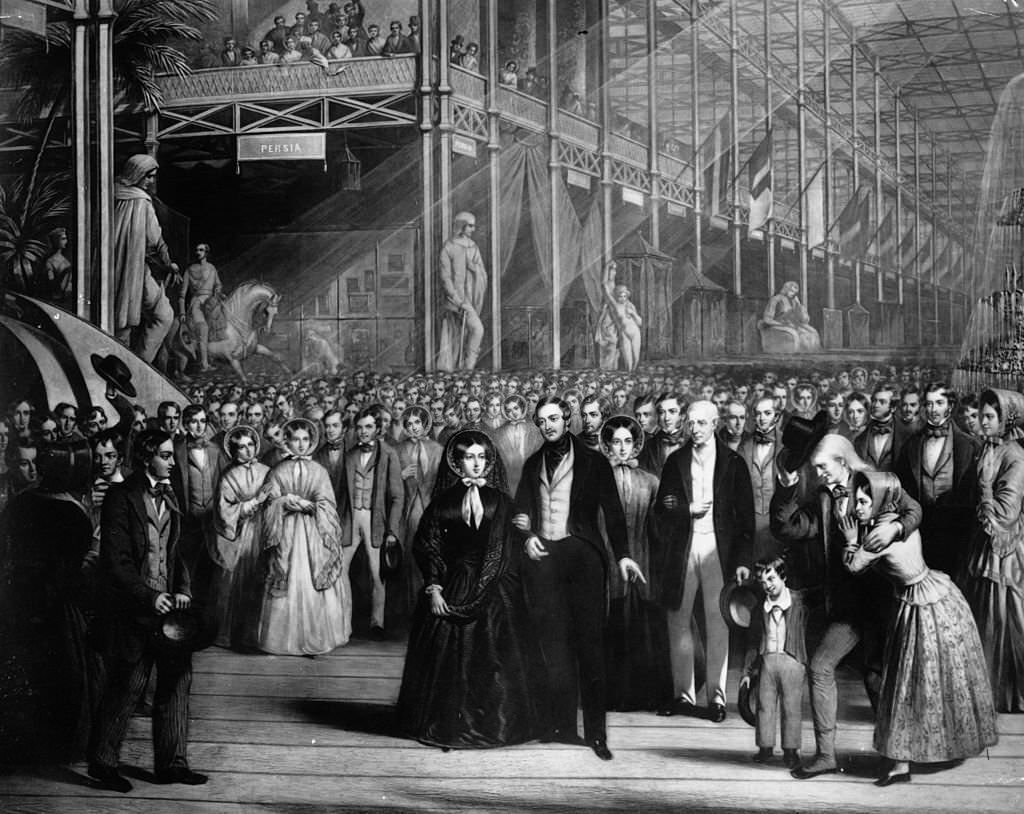 #50 Queen Victoria (1819 – 1901) with her consort Prince Albert (1819 – 1961) and the Duke of Wellington (1769 – 1852) at the opening of the Great Exhibition at Crystal Palace, Hyde Park, London.