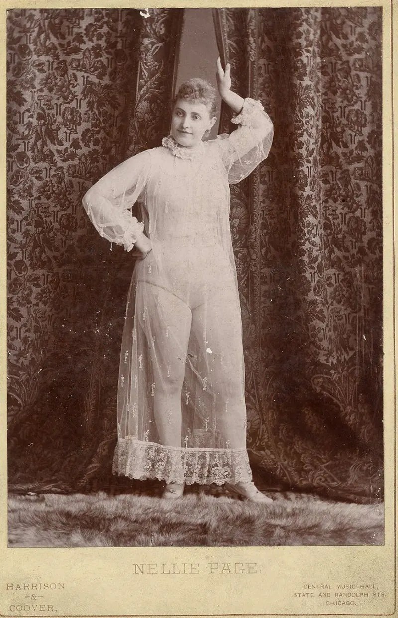 #15 Nellie Page posing in a nightgown.
