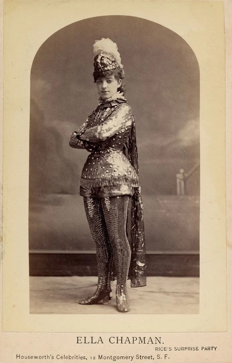 #2 Ella Chapman in short metallic armor costume, including leggings, helmet with feather. Rice’s surprise party.