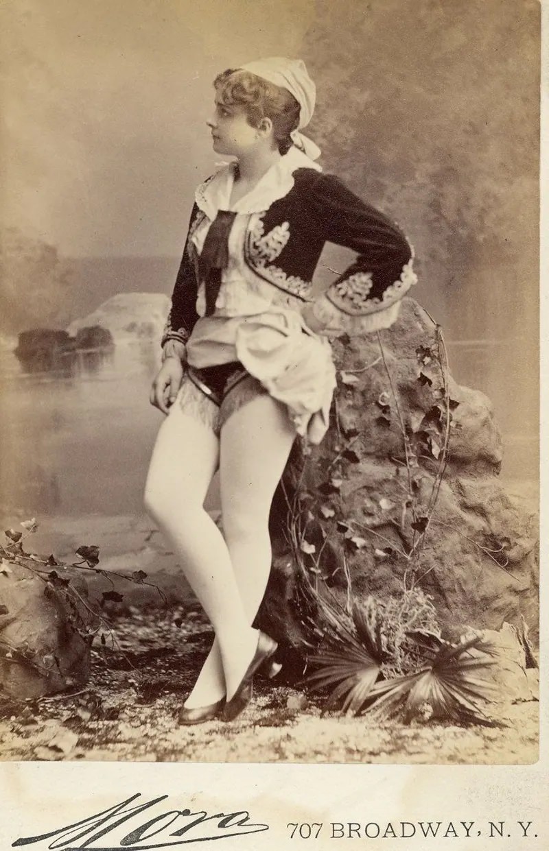 #20 Pauline Hall in a short, Greek style costume, flat shoes.