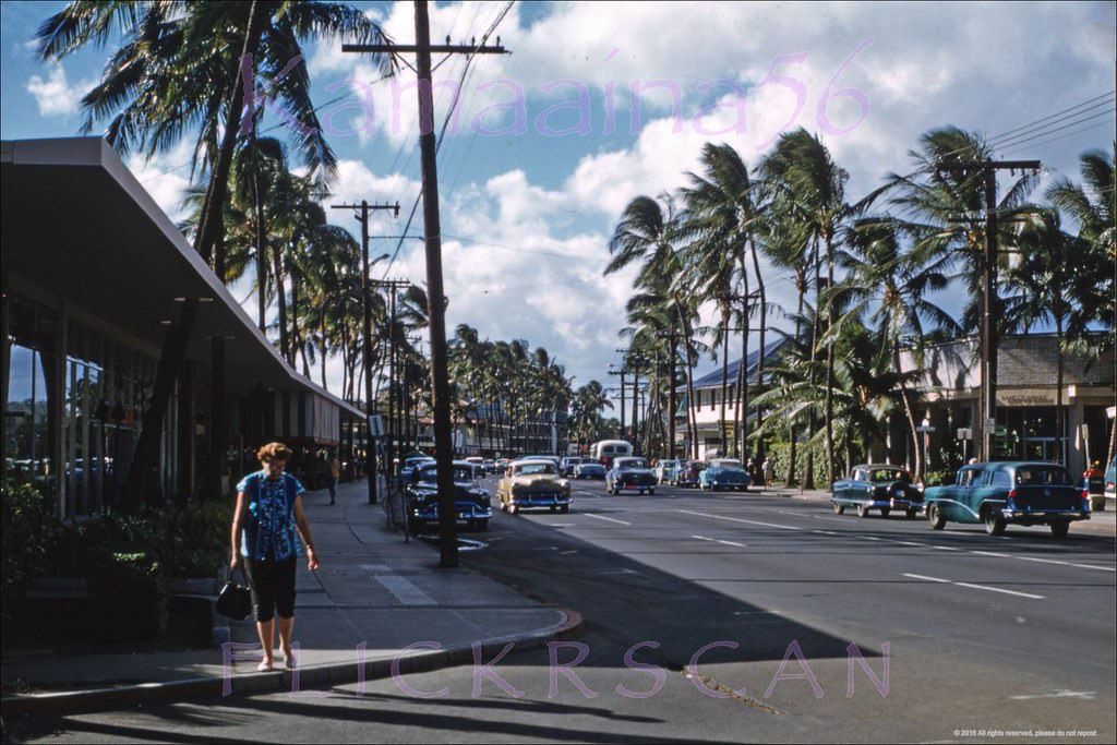#93 View along Waikiki’s Kalakaua Avenue from the Royal Hawaiian Hotel driveway, 1958