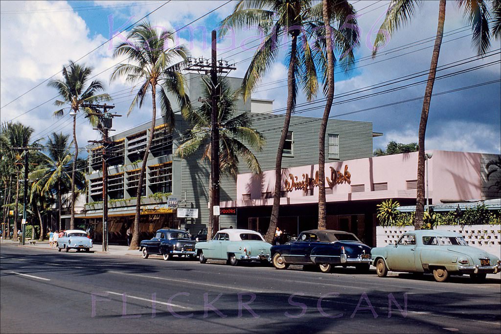 Winifred Dick ladies’ clothes and liquor store (now that’s positive reinforcement for the hubbies!) next door to the Waikiki Medical Building on Kalakaua Avenue, 1954.