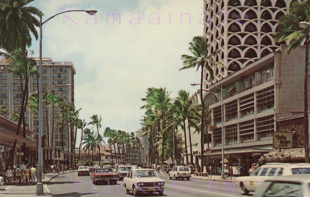 #49 Ewa view (more or less west here) along Kalakaua Avenue between Royal Hawaiian and Lewers back when Kalakaua was still a two-way street and after the on-street parking and parking meters were gone, 1969
