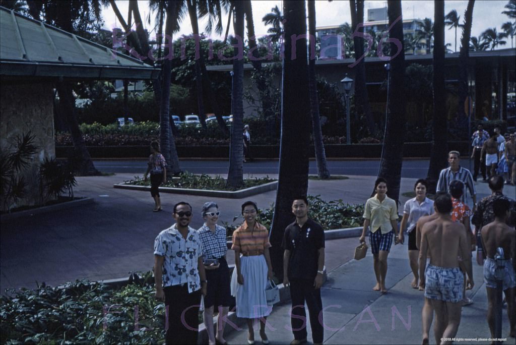 #103 Unusual angle on Waikiki’s Kalakaua Avenue seen from a statehood parade grandstand on the corner with Seaside Avenue, 1959