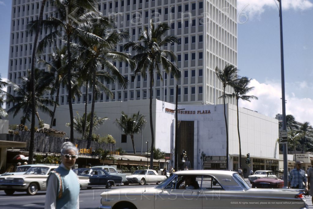 #61 Waikiki’s busy Kalakaua Avenue viewed from the original driveway at the Royal Hawaiian Hotel, 1965.