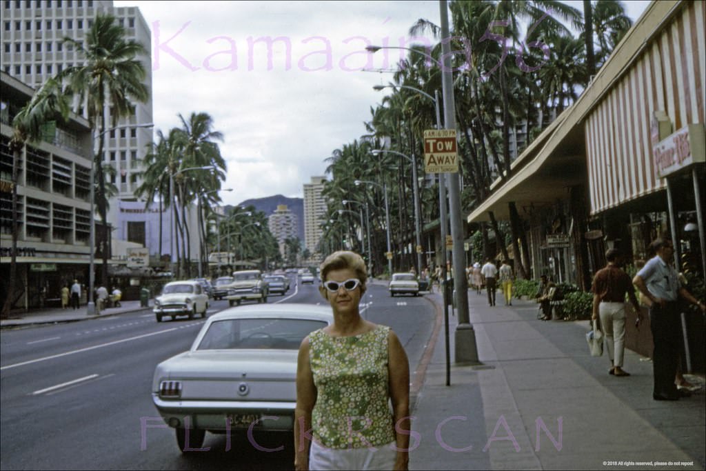 #65 Looking east along Waikiki’s Kalakaua Avenue from the intersection with Royal Hawaiian Avenue at left, 1966
