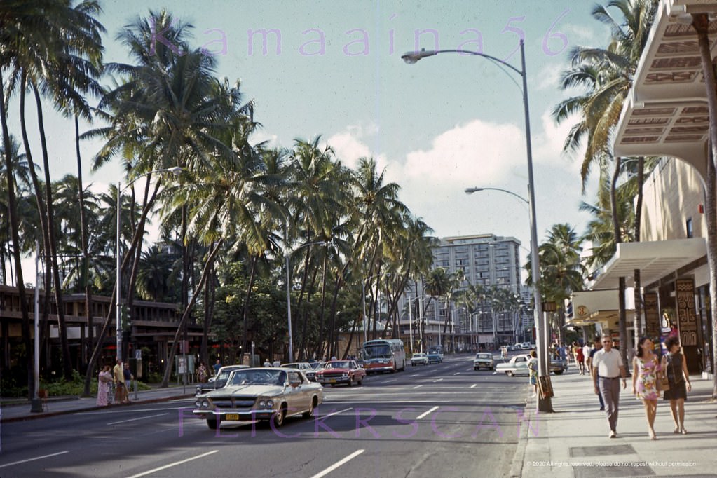 #9 Late afternoon looking more or less west along Waikiki’s Kalakaua Avenue shortly after its 1971 conversion to one-way Diamond Head with no more on-street parking.