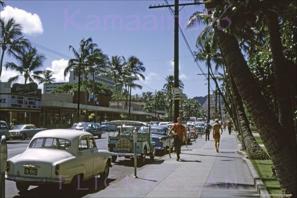 #78 Morning view along Waikiki’s Kalakaua Avenue looking Diamond Head from the Royal Hawaiian Hotel’s street front gardens, 1963