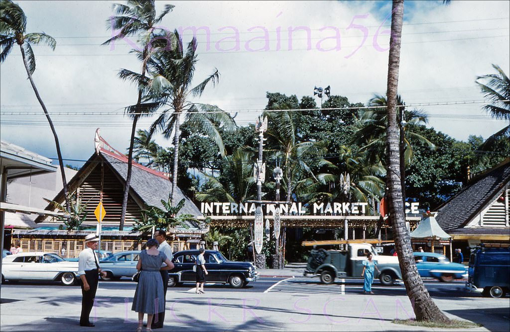 #83 Old Outrigger Arcade looking across Kalakaua Avenue at the now-gone International Market Place, 1960