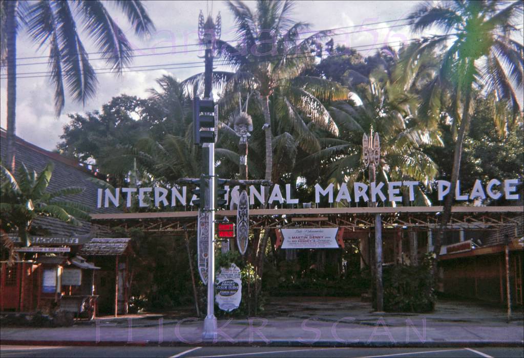 #88 Morning light in Waikiki looking across Kalakaua Avenue at the International Market Place, 1962